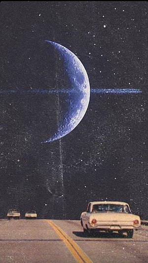 Vintage white car driving on a highway under a giant blue crescent moon in a starry night sky HD phone wallpaper