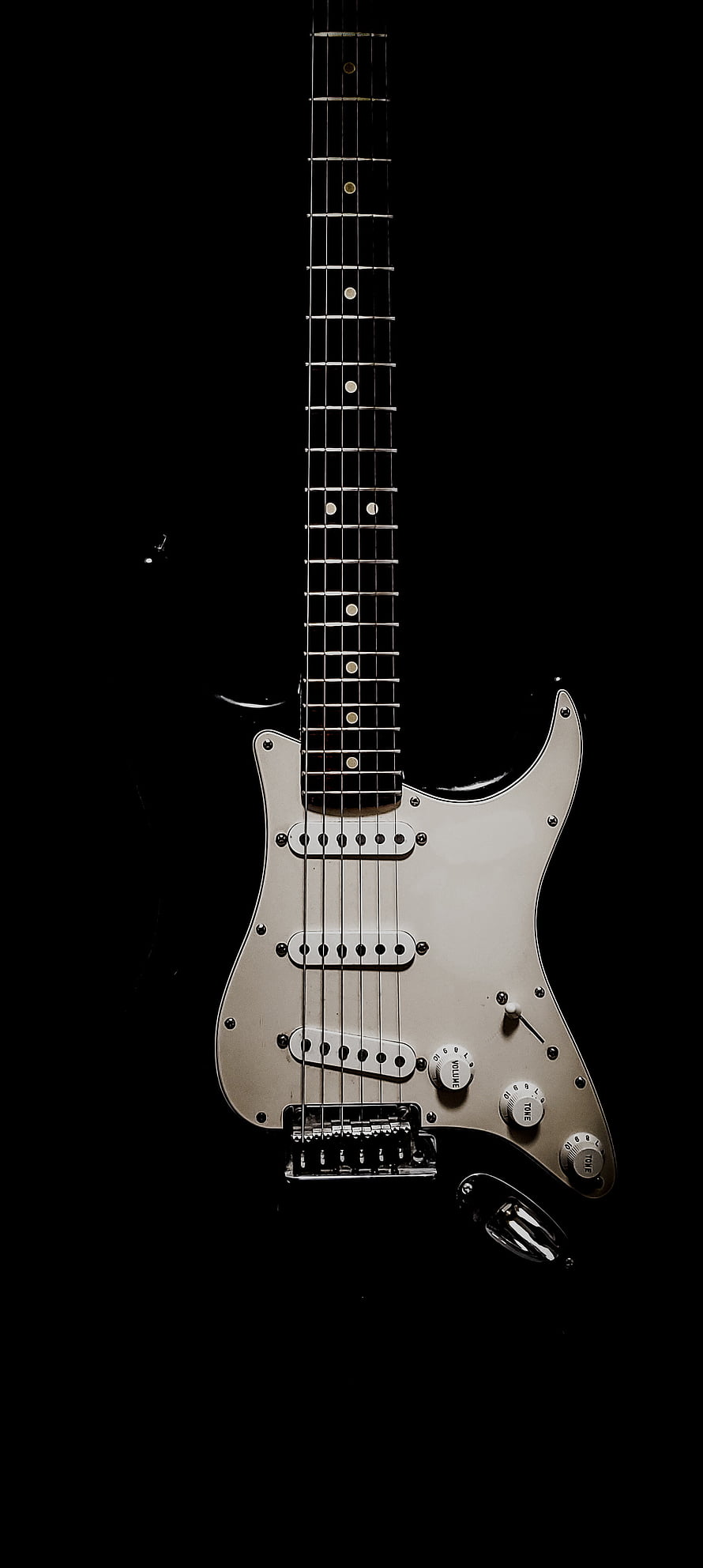 Silver Fender Stratocaster Electric Guitar on Black Background HD phone wallpaper