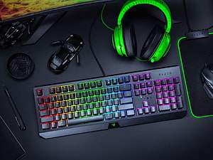 Razer Gaming Setup with RGB Keyboard and Neon Green Headphones on Dark Desk HD wallpaper