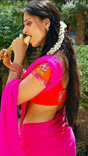 Anushka Shetty in Vibrant Pink Saree with Traditional Floral Hairpiece HD phone wallpaper
