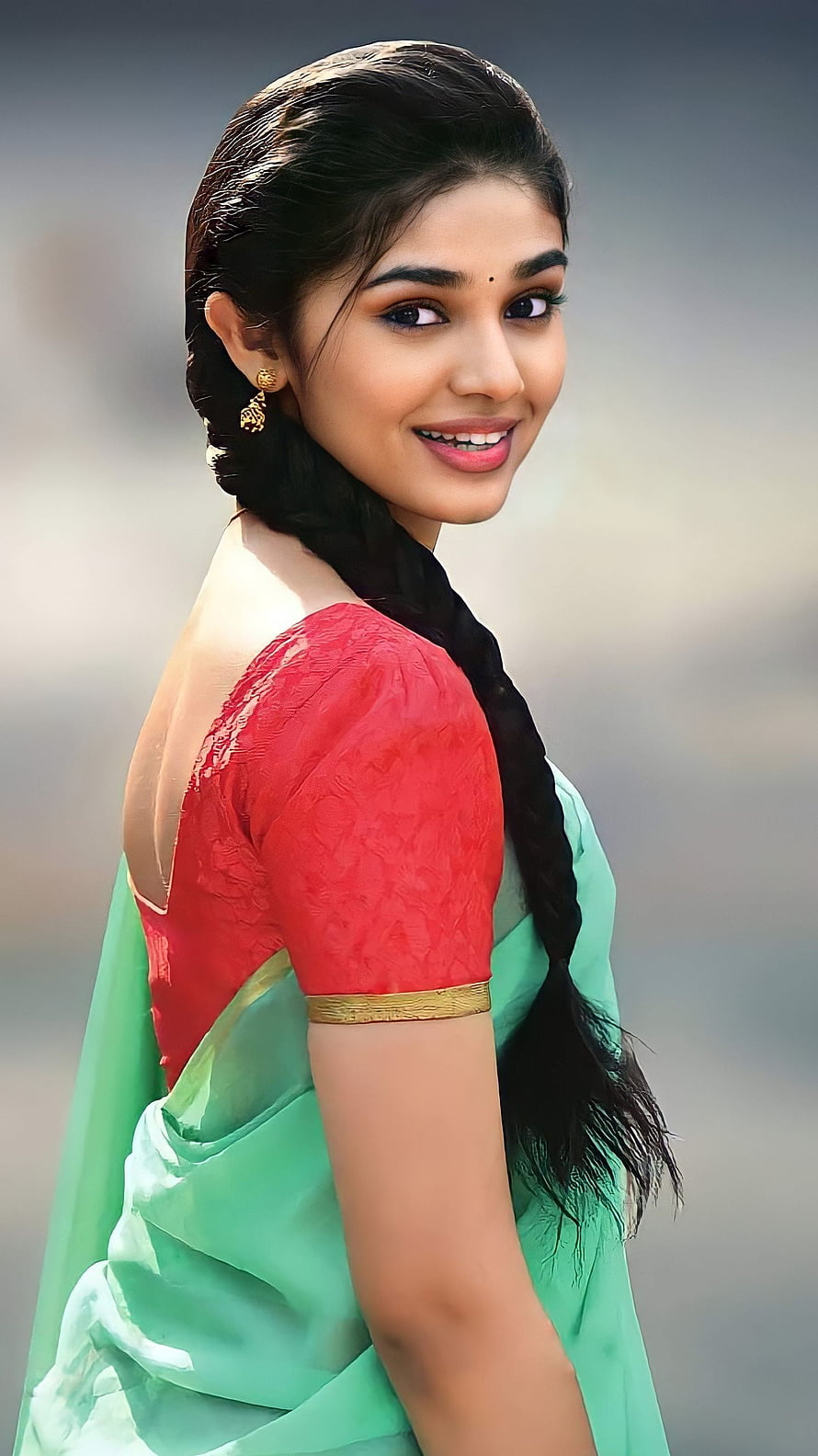 Portrait of a woman in a green saree and red blouse with a long braid, Krithi shetty, kriti shetty, saree beauty HD phone wallpaper