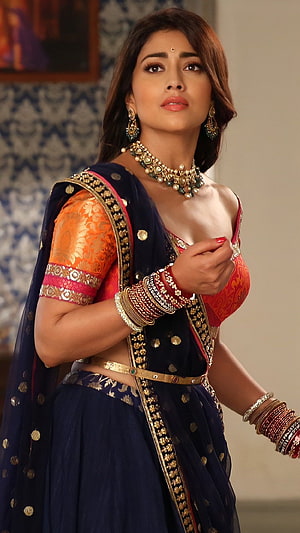 Shruti Haasan in a stunning navy blue lehenga with orange blouse and traditional jewelry HD phone wallpaper