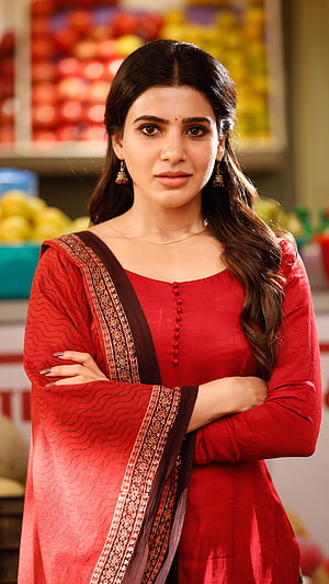 Saiyami Kher in a red salwar kameez with arms crossed in a grocery store setting HD phone wallpaper