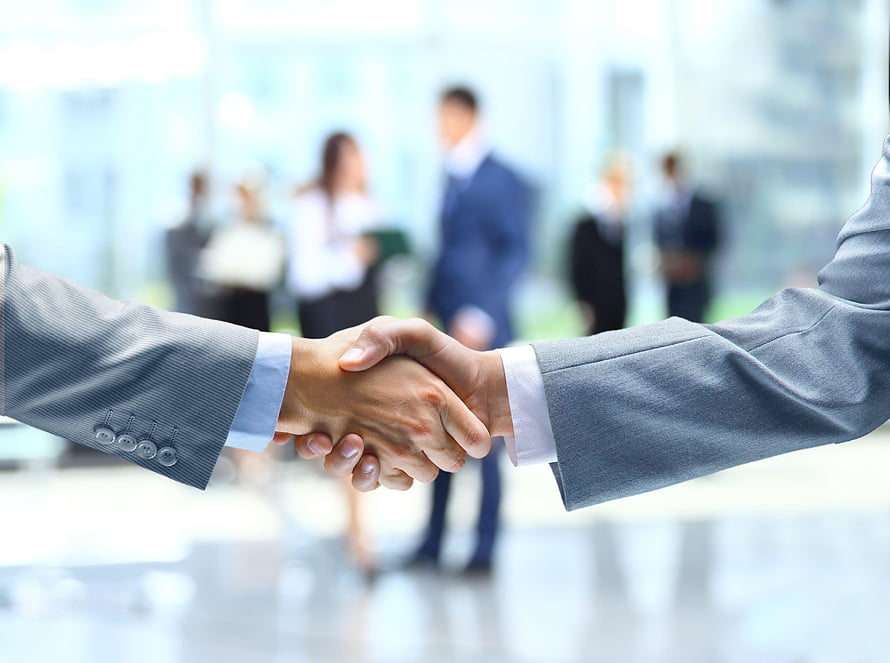 Professional Business Handshake in Modern Corporate Office Setting HD wallpaper