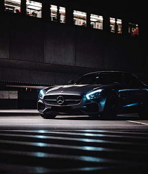 Mercedes-AMG GT Coupe in Matte Grey Parked in a Dark Underground Garage at Night HD phone wallpaper