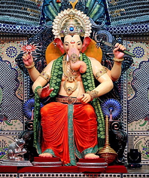 Lalbaugcha Raja Ganesha Murti in Traditional Temple Setting with Ornate Decorations HD phone wallpaper