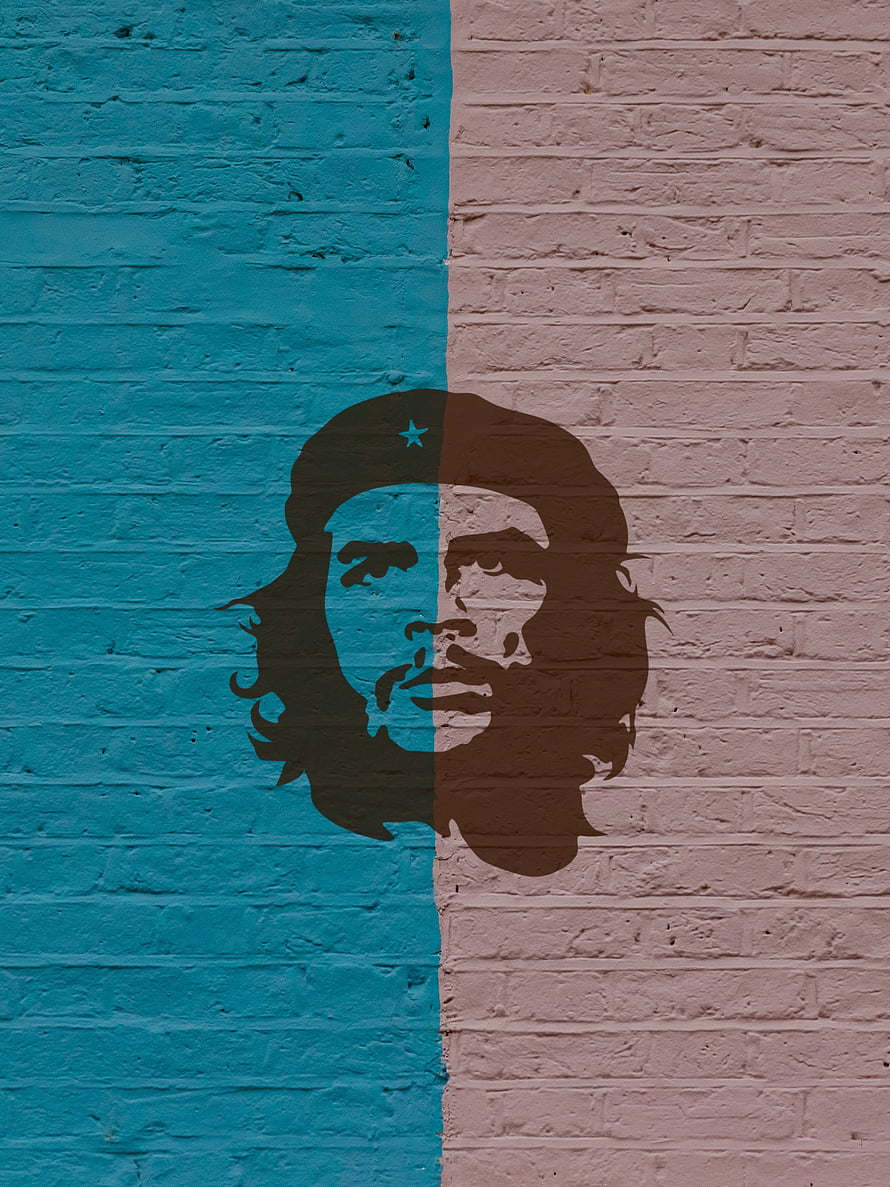 Che Guevara silhouette mural on a split teal and pink brick wall HD phone wallpaper