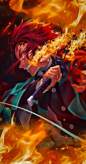 Rengoku Kyojuro from Demon Slayer Wielding Flaming Nichirin Sword in Intense Battle HD phone wallpaper