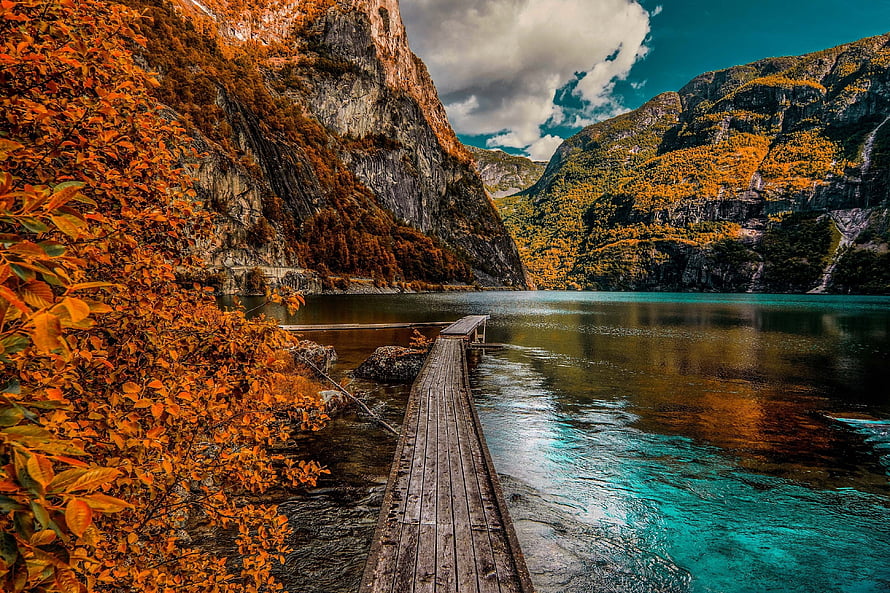 Autumnal Lake Scene With Weathered Wooden Dock And Vibrant Foliage HD wallpaper