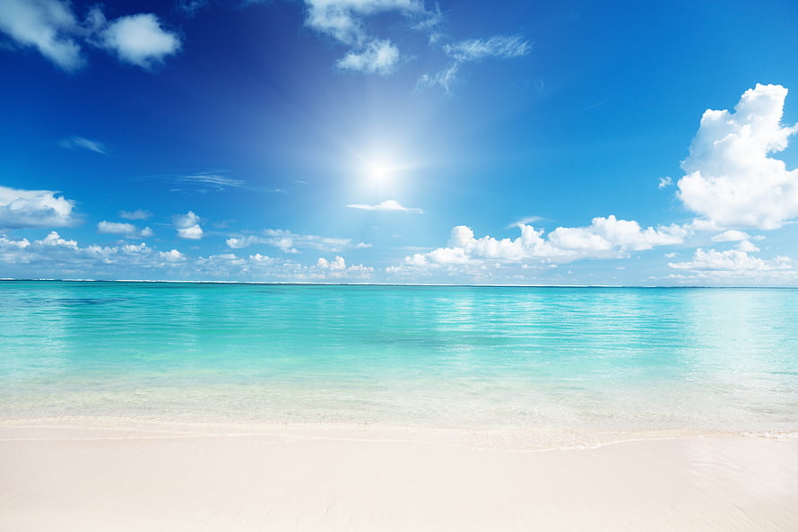 Serene Tropical Beach With Turquoise Water And White Sand Under A Bright Blue Sky HD wallpaper