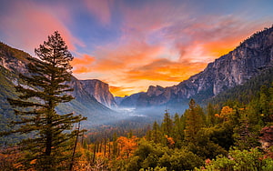 Yosemite National Park Valley at Sunset with Dramatic Orange Sky and Misty Forest HD wallpaper