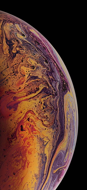 Vibrant Swirling Liquid Marble Sphere Against Black Space Background HD phone wallpaper