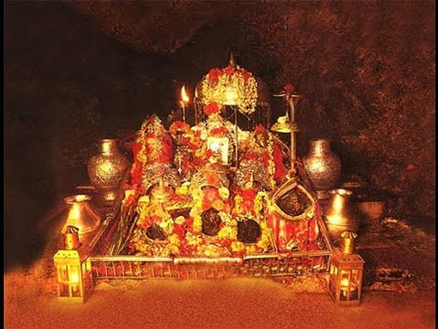 Maa Vaishno Devi Shrine Adorned With Marigold Garlands And Oil Lamps In A Sacred Cave HD wallpaper
