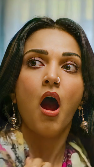 Close-up portrait of a woman with dark hair and traditional earrings expressing shock with wide eyes and open mouth, Kiara Advani, bollywood actress HD phone wallpaper