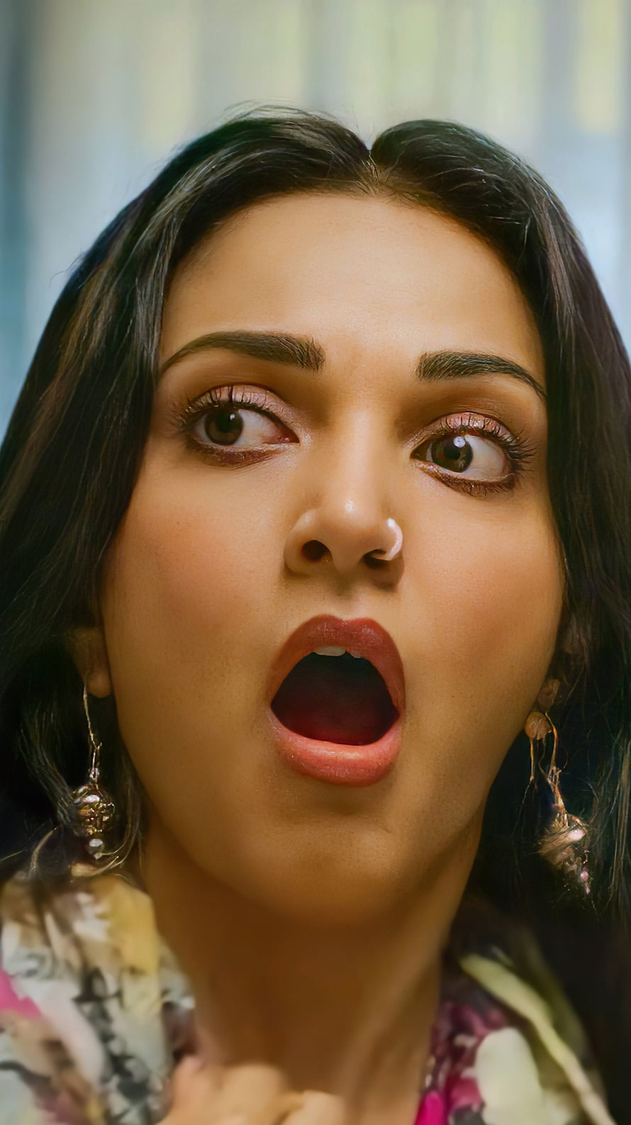 Close-up portrait of a woman with dark hair and traditional earrings expressing shock with wide eyes and open mouth, Kiara Advani, bollywood actress HD phone wallpaper