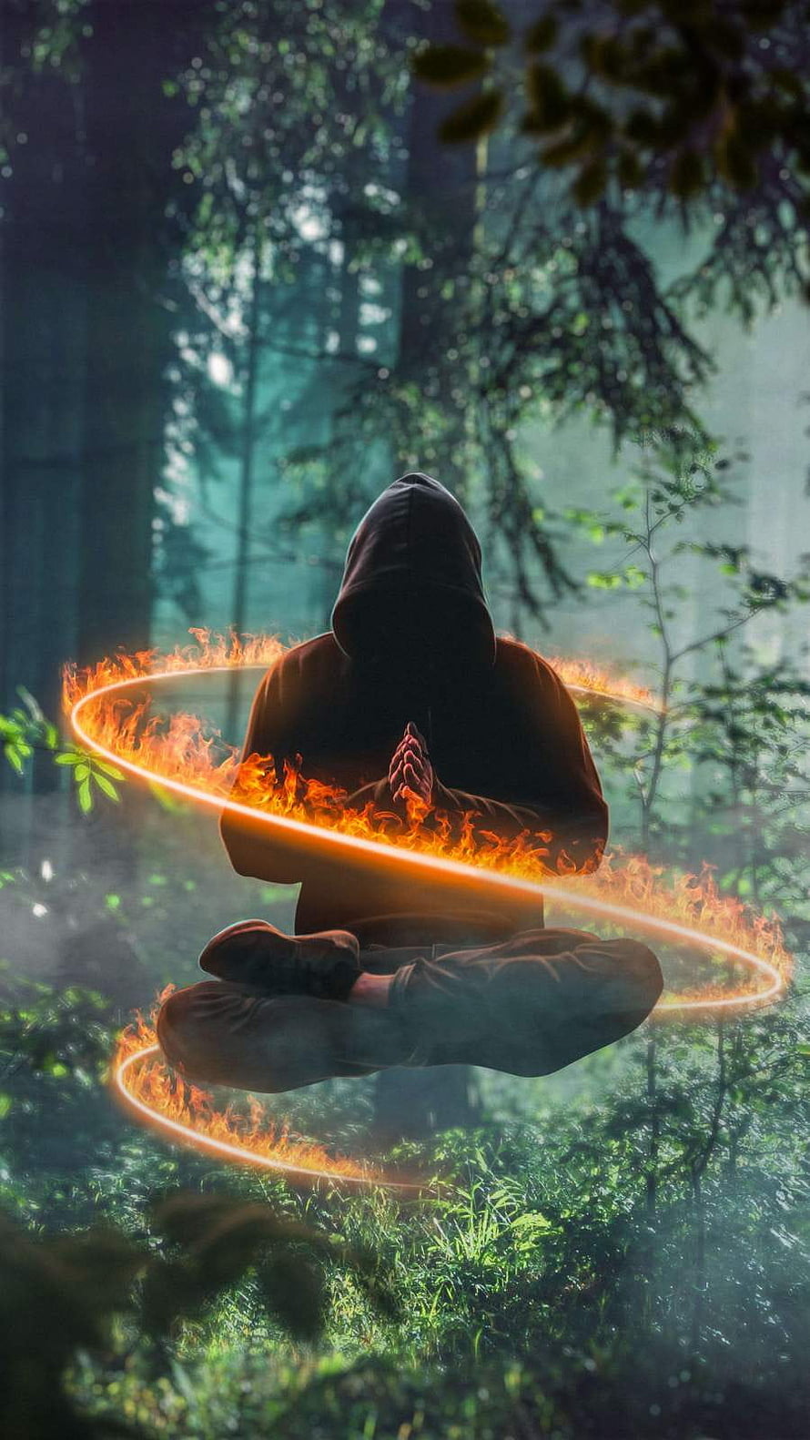 Mystical Hooded Figure Meditating in a Glowing Fire Ring Within a Misty Forest HD phone wallpaper