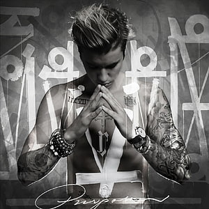 Justin Bieber in Prayer Pose with Cross Tattoo and Gothic Typography HD phone wallpaper