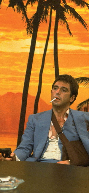 Al Pacino as Tony Montana in Scarface with palm trees and sunset backdrop HD phone wallpaper
