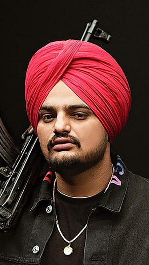 Sidhu Moose Wala Portrait Wearing Red Turban With Gold Chain And Black Jacket HD phone wallpaper
