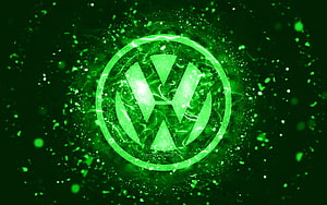 Volkswagen emblem glowing in vibrant green neon with abstract particle effects and electric energy HD wallpaper
