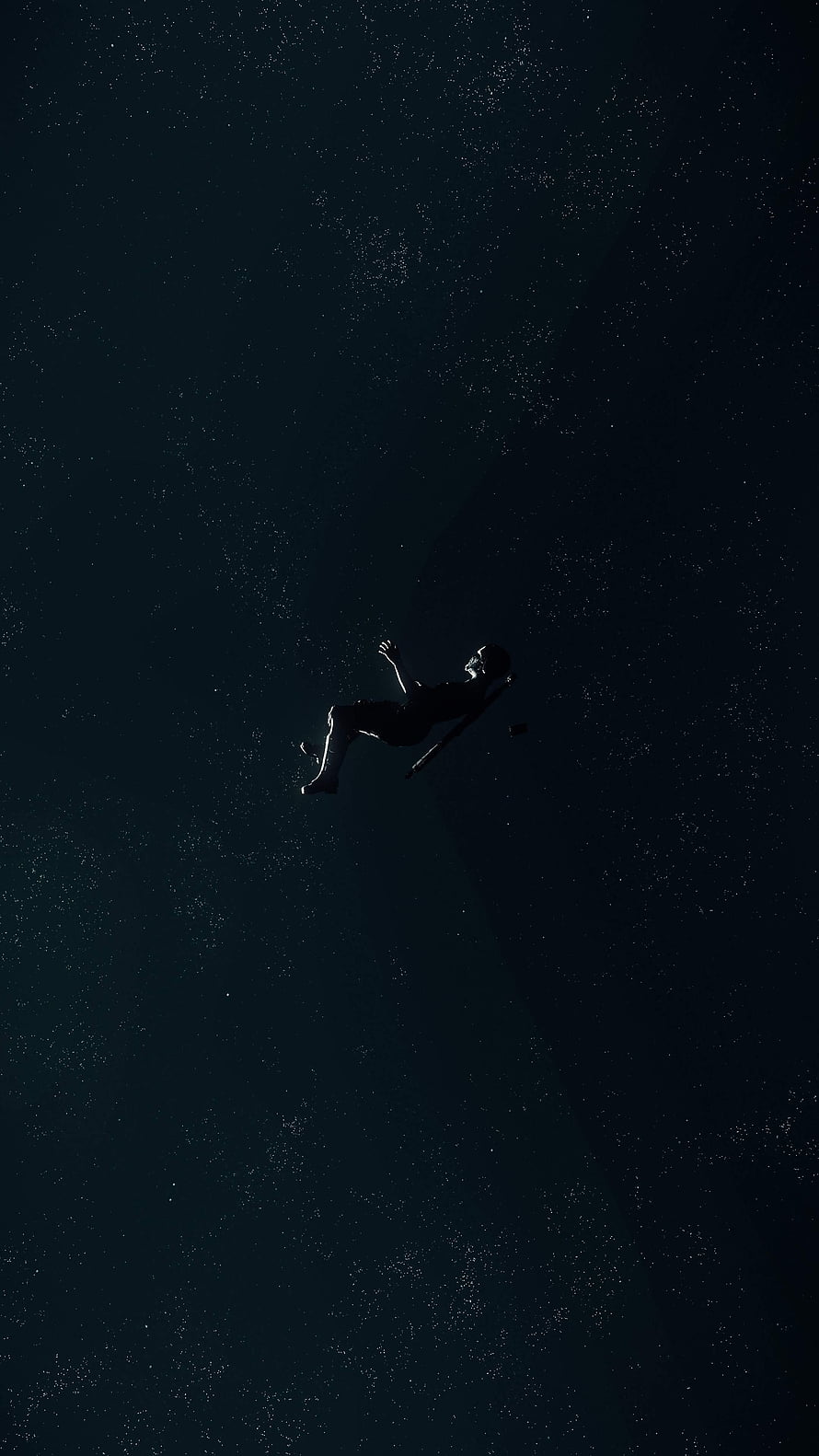 Silhouette of a person floating in deep space surrounded by stars HD phone wallpaper