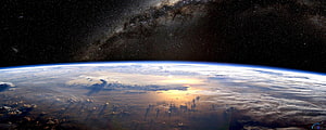 Earth Horizon From Space With Milky Way Galaxy And Sunrise Clouds HD wallpaper