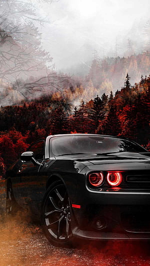 Black Dodge Challenger SRT in Misty Autumn Forest with Glowing Red Headlights HD phone wallpaper