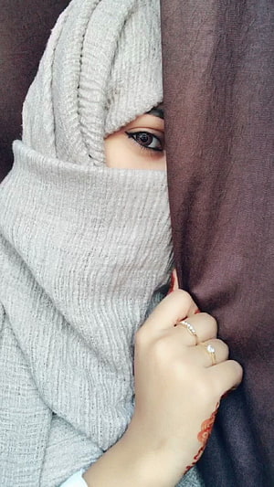 Close-up portrait of a woman in a grey knitted hijab and niqab with henna hand, Miss Khan on Hijab dpz. Girl hijab, Niqab HD phone wallpaper