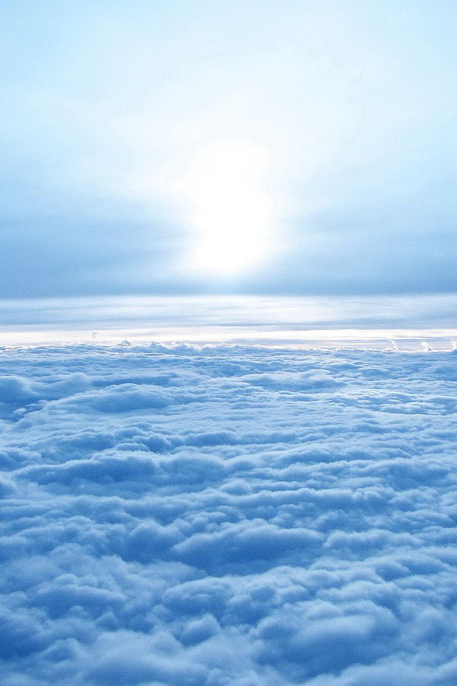 Serene Sea of Clouds with Bright Sunlight Breaking Through the Sky HD phone wallpaper