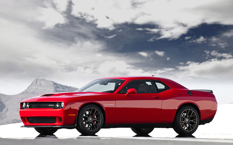Red 2015 Dodge Challenger SRT Hellcat Muscle Car Profile Against Dramatic Sky HD wallpaper