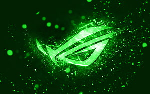 Glowing Green ROG Republic of Gamers Logo with Neon Particle Effects on Dark Background HD wallpaper