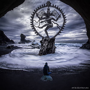 Nataraja Shiva Statue on Rocky Shore with Meditating Figure and Ocean Waves HD phone wallpaper