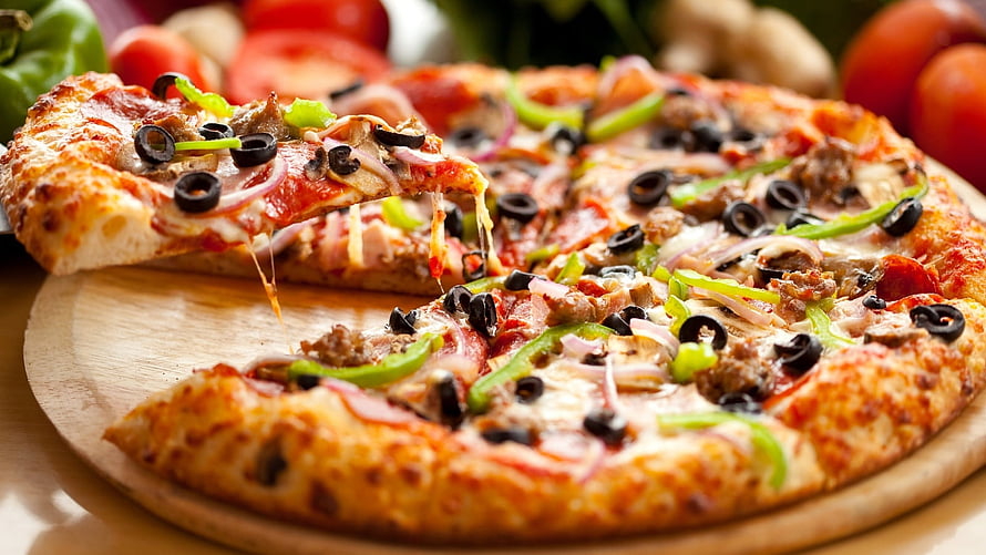 Freshly Baked Pizza With Melting Cheese, Black Olives, Peppers, and Sausage on a Wooden Board HD wallpaper
