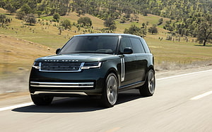 2022 Range Rover Autobiography P400 LWB driving on a scenic highway through rolling hills HD wallpaper