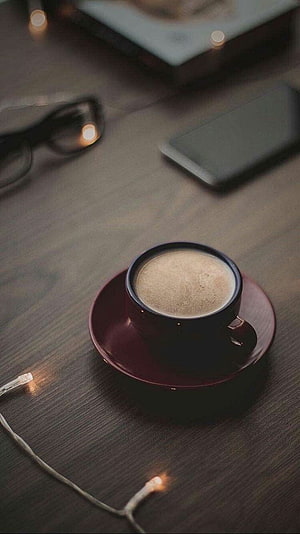 Cozy Aesthetic Coffee Cup on Dark Wood Table with Warm Fairy Lights HD phone wallpaper