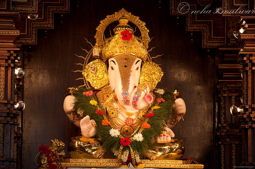 Dagdusheth Ganpati Murti Adorned With Gold Crown And Floral Garland HD wallpaper