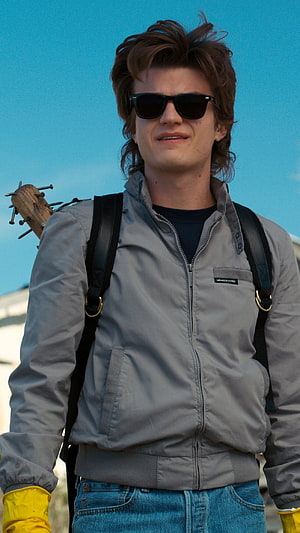 Joe Keery as Steve Harrington in Stranger Things wearing grey jacket and sunglasses HD phone wallpaper