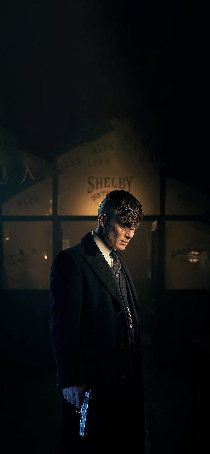 Thomas Shelby from Peaky Blinders standing in dark coat holding gun HD phone wallpaper