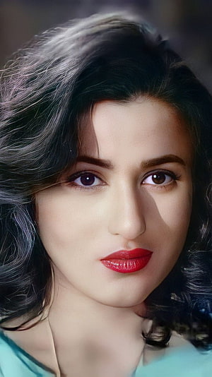 Portrait of Bollywood Actress Madhuri Dixit with Dark Wavy Hair and Red Lipstick HD phone wallpaper