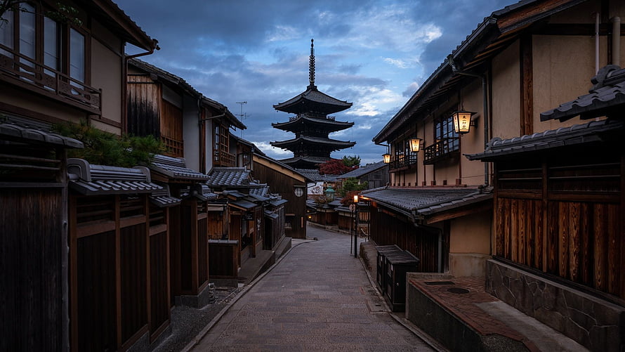 Traditional Kyoto Street at Dusk with Five-Story Pagoda and Wooden Architecture HD wallpaper
