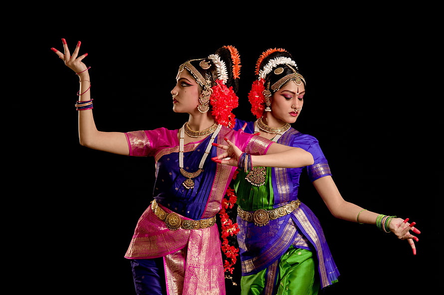 Two Dancers in Vibrant Traditional Costumes Performing Kathak Classical Indian Dance HD wallpaper