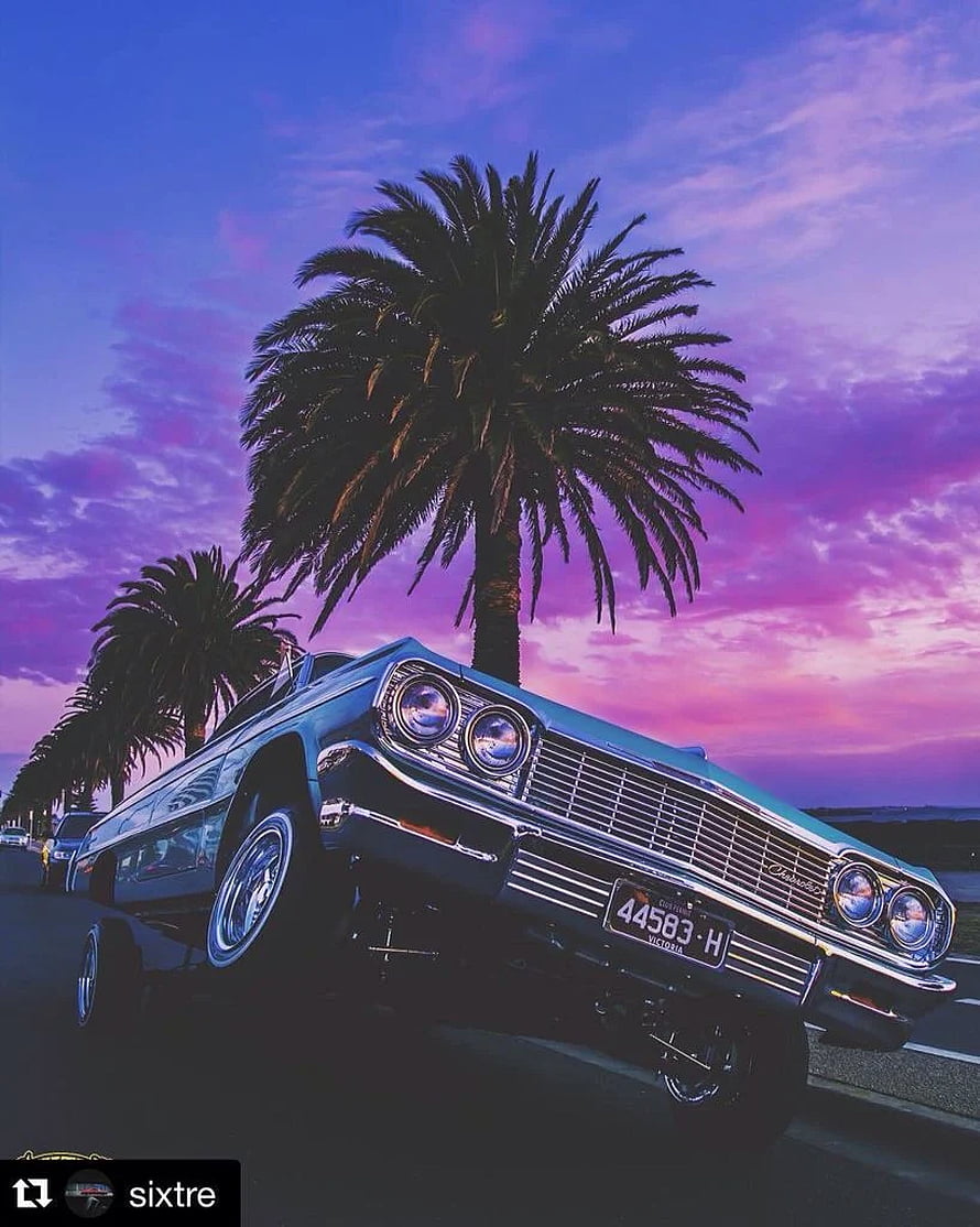 1964 Chevrolet Impala Lowrider Parked Under Palm Trees at Sunset HD phone wallpaper