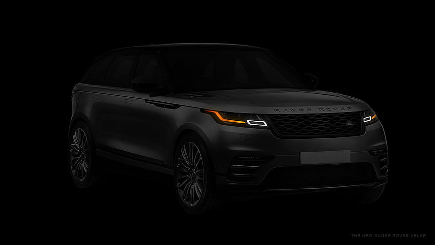 Matte Black Range Rover Velar SUV with Illuminated Headlights on Dark Background HD wallpaper