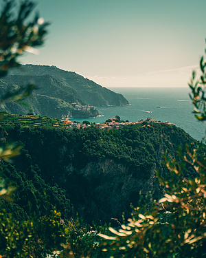 Coastal Cliffside Village Overlooking the Mediterranean Sea with Lush Green Hills HD phone wallpaper