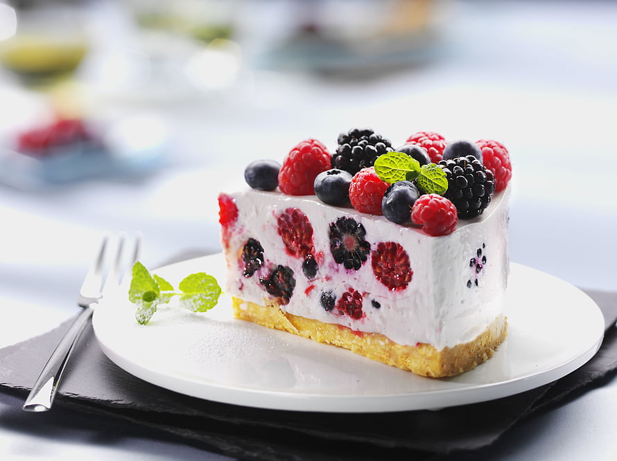 Fresh Berry Cream Cake Slice with Raspberries, Blackberries, and Blueberries on a White Plate HD wallpaper