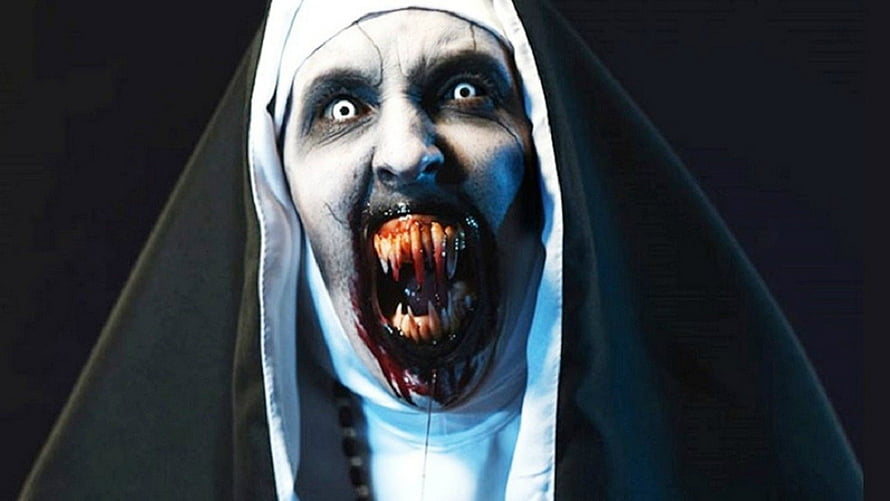 Valak The Nun Horror Character with Blood-Soaked Fangs and Terrifying Expression HD wallpaper