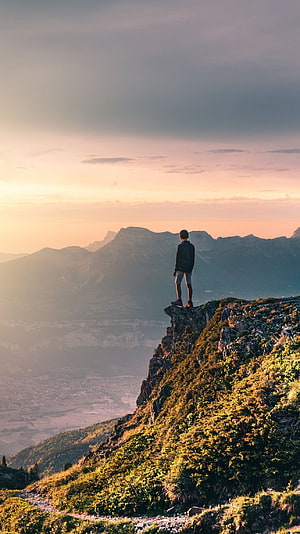 Man Standing on Cliff Edge Overlooking Mountain Valley at Sunset, Alone, Boy, Sad Life HD phone wallpaper