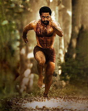 Jr NTR as RRR Character Running Through Jungle With Blood Stains HD phone wallpaper