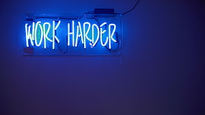 Blue Neon Sign with Work Harder Text on Dark Wall HD wallpaper