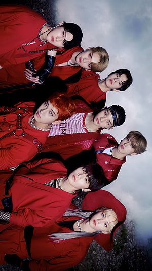 Stray Kids Group Portrait in Red Outfits Against Dramatic Sky HD phone wallpaper